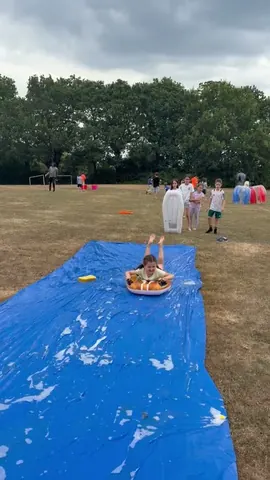 Children playing on the field at summer camp